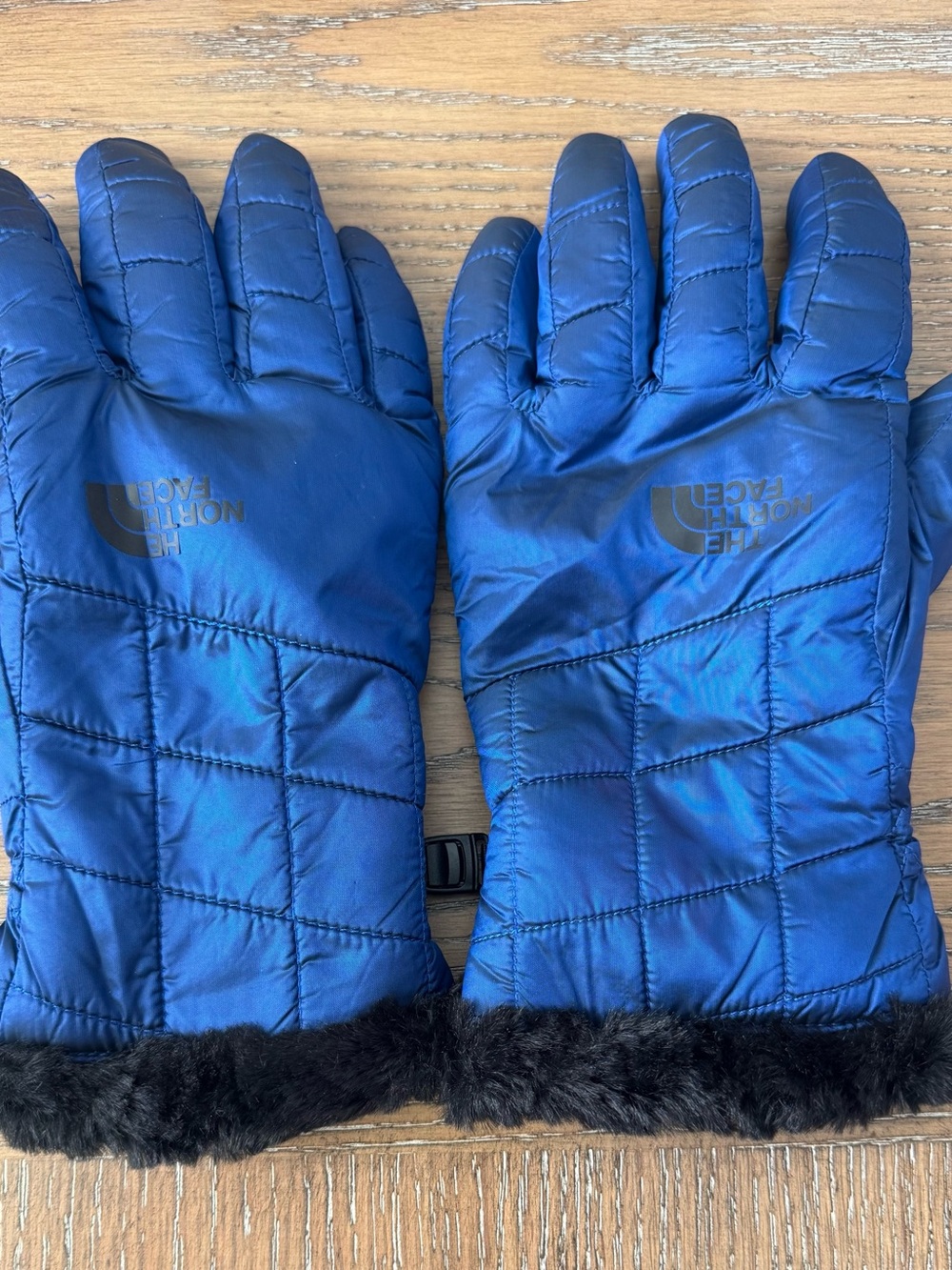 The North Face Woman’s Royal Blue Quilted Insulated Gloves with Faux-Fur Trim